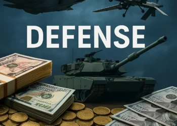 Editorial illustration representing US defense spending: stacks of 100 dollar bills and gold coins surrounding an M1 Abrams tank, F-35 Lightning II fighter jet, and a military drone with the text DEFENSE