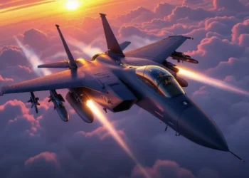 F-15 Eagle fighter jet flying over clouds at sunset with full weapon loadout