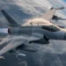 High-altitude view of a Pakistan Air Force JF-17 Thunder Block 3 fighter jet executing a banking maneuver. The image clearly details the stealthy Diverterless Supersonic Inlets (DSI) and a full payload of PL-15 long-range BVR missiles under the wings, highlighting its 4.5-generation capabilities.